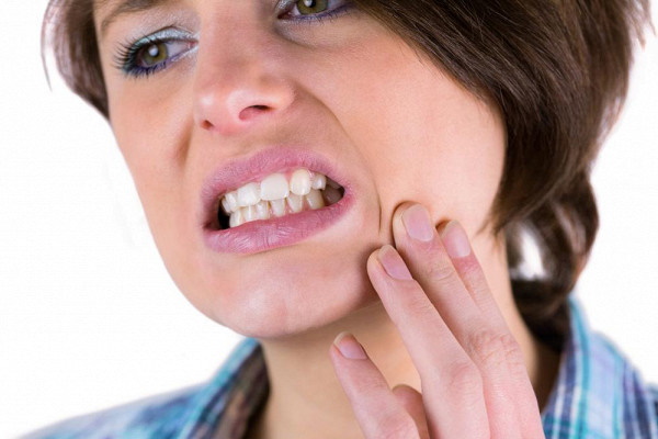 Болит зуб под коронкой - причины